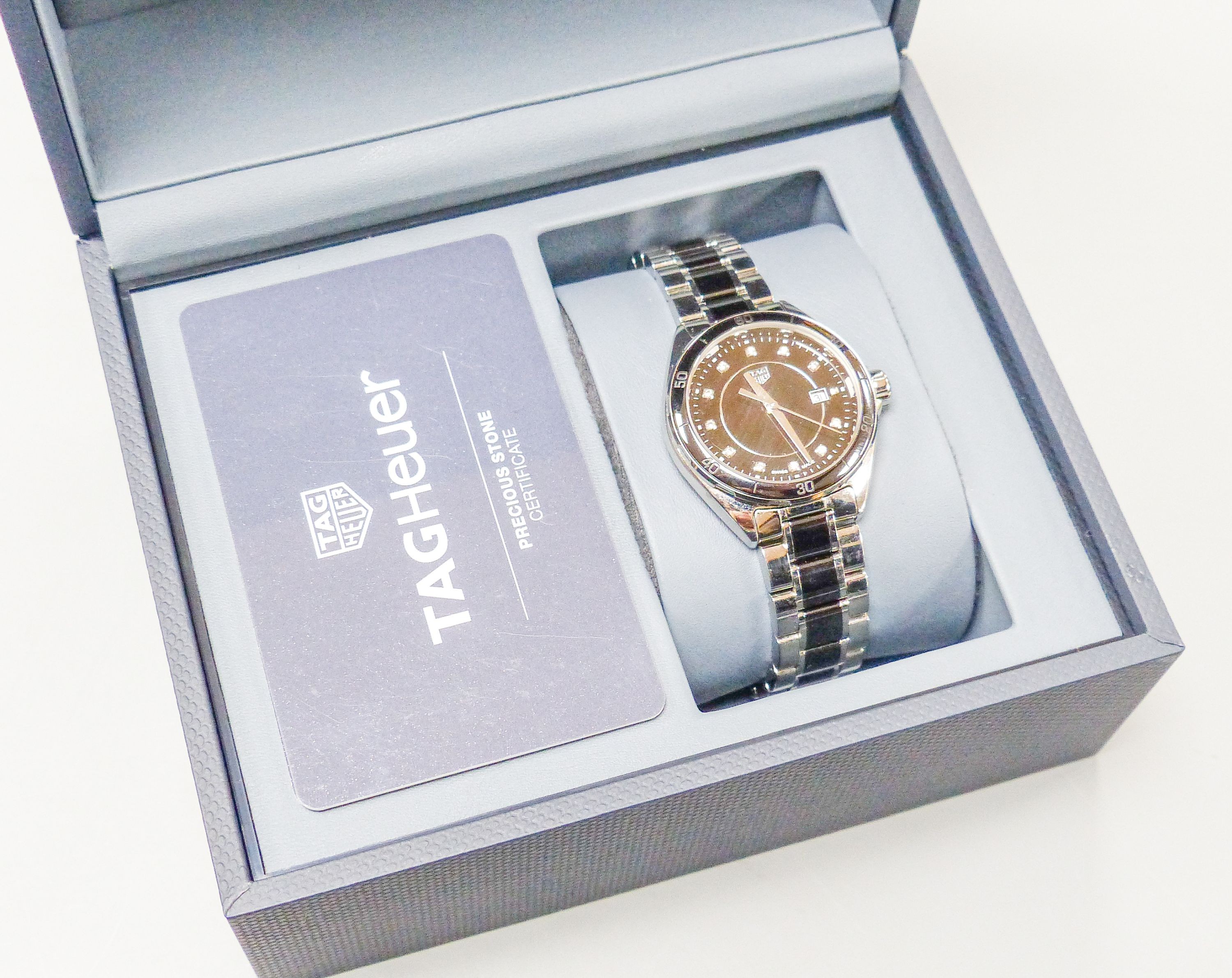 A modern stainless steel Tag Heuer quartz wrist watch with diamond dot numerals, case diameter 32mm, with box.
